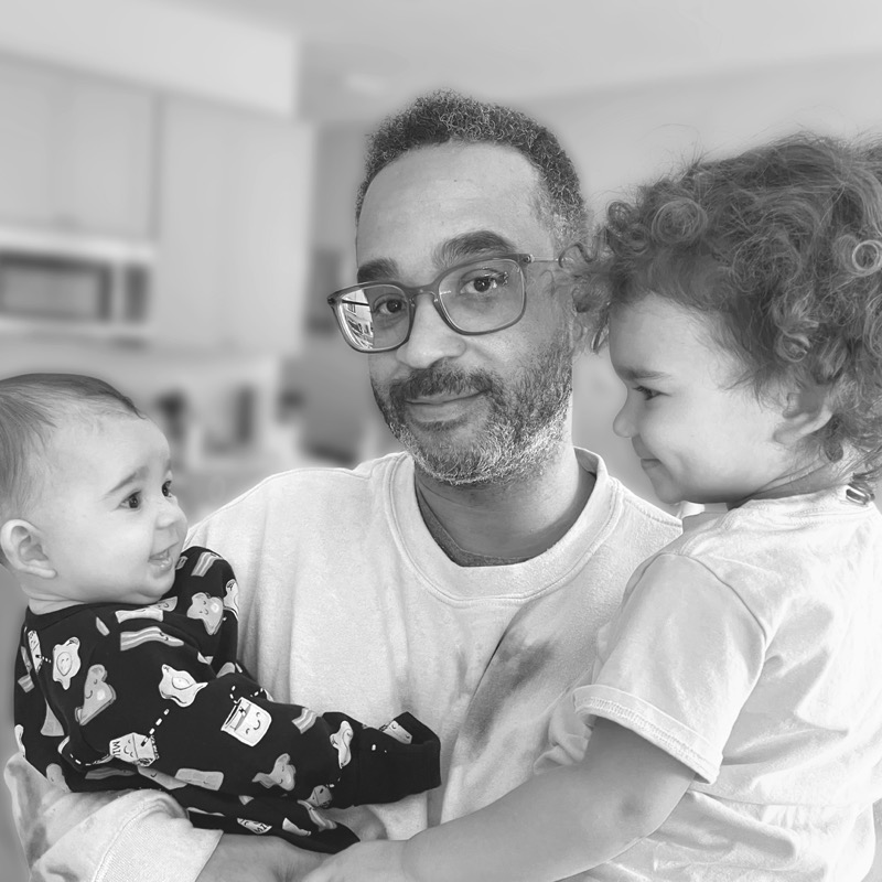Corday Cardwell holding his two daughters